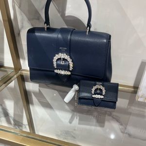 A beautiful brand new Jimmy Choo navy blue handbag and wallet. Strap included.